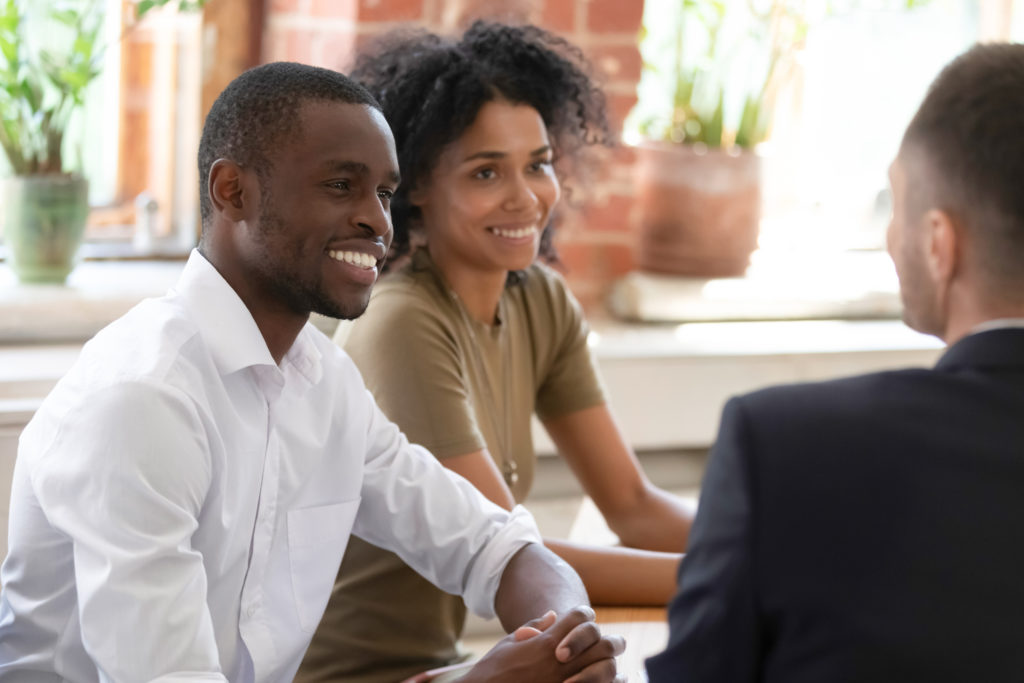 3 people interviewing at a table