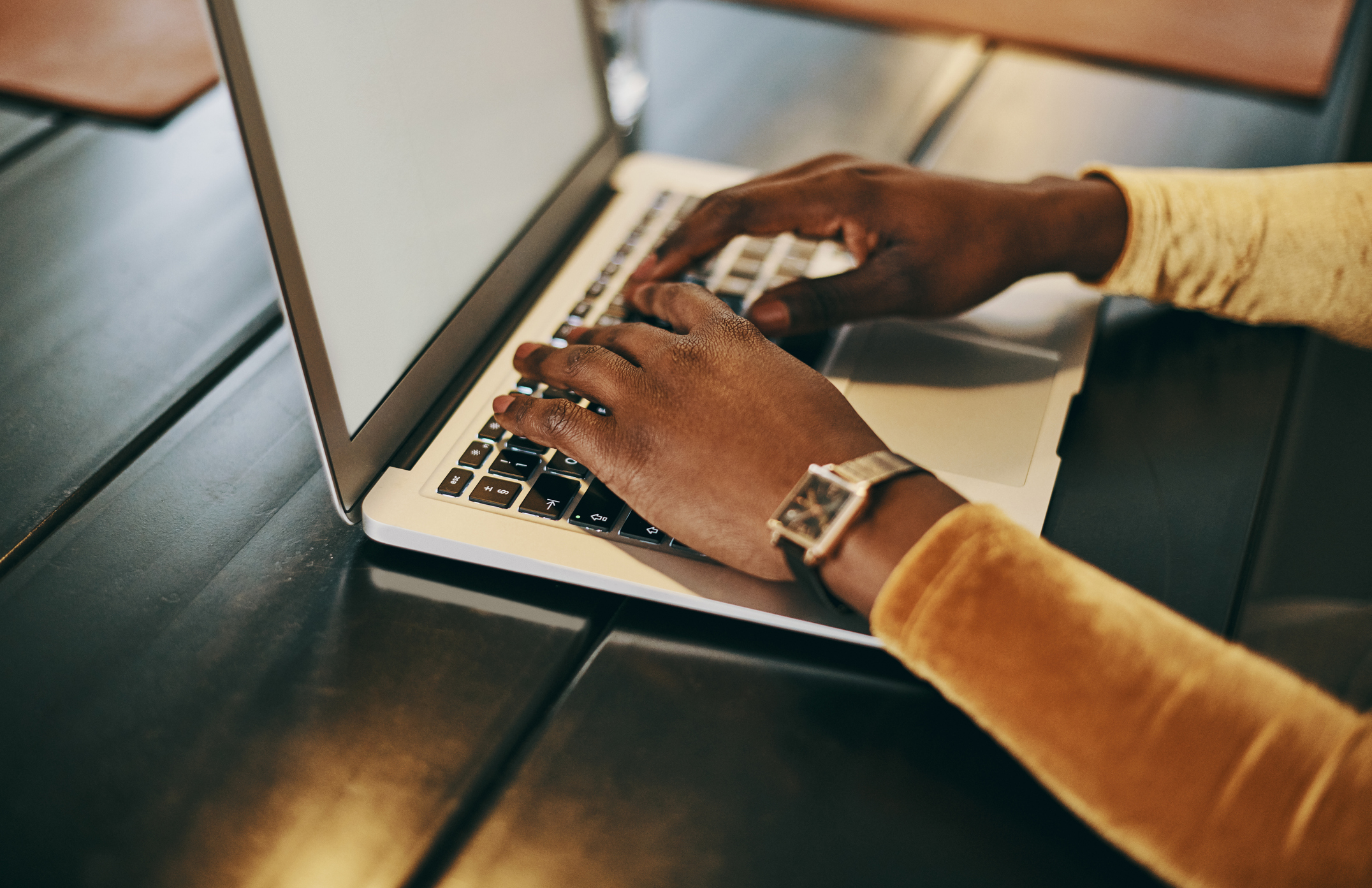 Person typing on a laptop